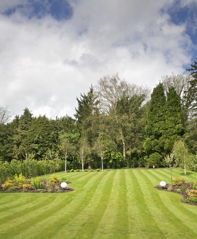 big lawn out on a farm and striped and cut